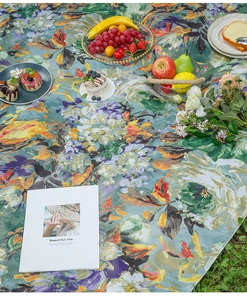 Close-up of thick floral picnic mat with waterproof texture and impressionist flower pattern