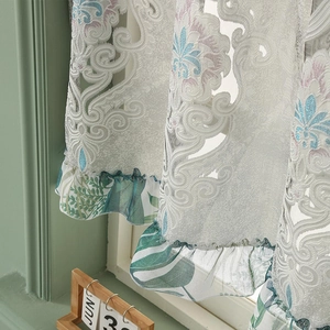Embroidered lace cafe curtain with floral patterns and ruffled palm leaf edge