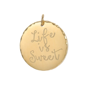 Detail of round gold pendant with Life is Sweet engraving and decorative wavy edges