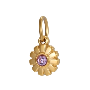 Macro detail of a golden daisy flower pendant with a purple cubic zirconia stone