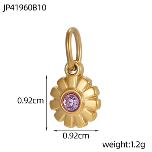 Macro view of flower-shaped pendant with purple zircon and gold petal detail