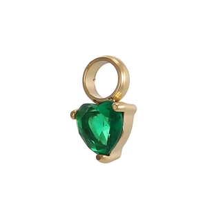Close-up of heart-shaped green zircon pendant with gold plated stainless steel frame
