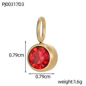 Detailed close-up of a 0.79cm red zircon pendant with gold-plated stainless steel edges