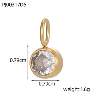 Detail view of round gold pendant with cubic zirconia and dimensions 0.79cm by 0.79cm