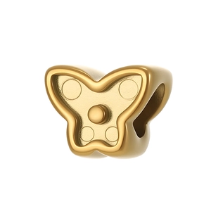 Vue détaillée du charme papillon doré avec texture à pois et trou de perle rond