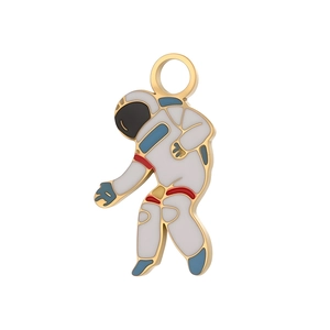 Detailed view of astronaut enamel charm with golden metal frame for DIY jewelry