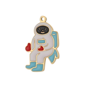 Detail showing an enamel astronaut pendant with a red heart for DIY jewelry