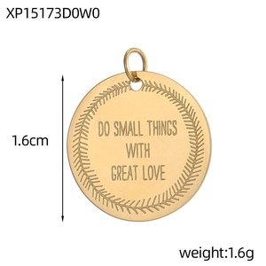 Detailed view of 1.6cm round gold stainless steel pendant with engraved inspirational text