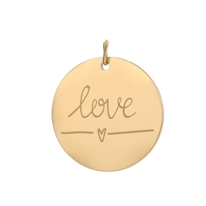 Close-up of golden circular pendant with love engraving and a small heart icon