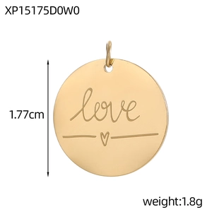 Detailed view of round gold stainless steel pendant with engraved love and heart symbol