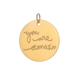 Macro shot of gold-plated stainless steel round pendant with You Are Amazing engraving