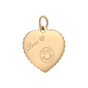 Detailed view of heart-shaped gold pendant with Love engraving and scalloped edges