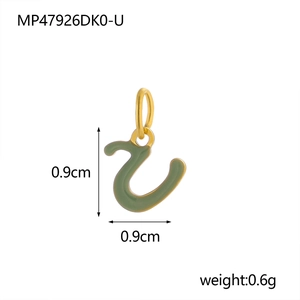 Macro shot of green enamel letter U pendant with gold trim and size 0.9cm measurement