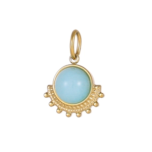 Macro shot of fan-shaped titanium pendant with light blue gemstone and gold finish