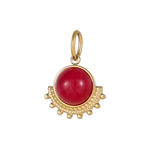 Detail view of a fan-shaped gold pendant with a red carnelian stone in vintage style