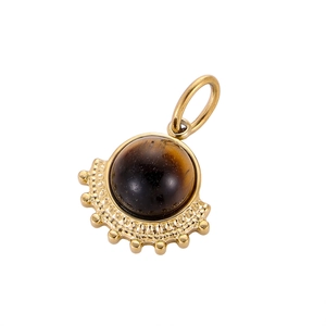 Macro view of vintage fan-shaped titanium steel pendant with natural tiger eye stone