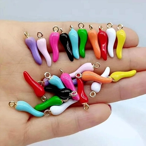 Set of colorful enamel chili pepper pendants in various vibrant shades for DIY jewelry