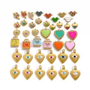 Detailed grid of colorful evil eye and heart charms in gold-plated stainless steel