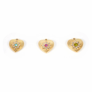 Detailed macro view of three heart-shaped gold pendants with colored zircon and crystals