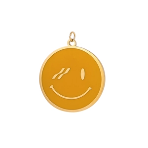 Detail of a round yellow enamel smiley face pendant with gold metal edges and wink face
