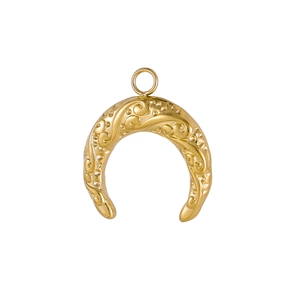 Detailed relief pattern on golden horseshoe pendant featuring floral scroll engravings