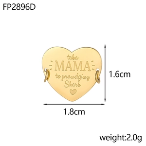 Detailed close-up of golden heart pendant featuring Polish engraving and dual link rings