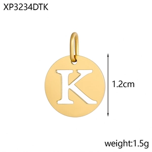 Close-up of gold-plated stainless steel round pendant with hollow letter K detail