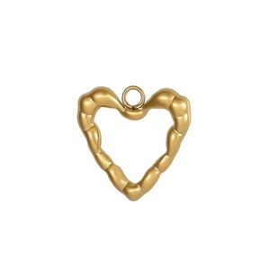 Macro shot of gold heart pendant with organic bamboo texture finish and metal ring