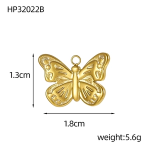 Detailed view of a gold butterfly pendant with measurements 1.3cm by 1.8cm and 5.6g weight