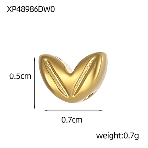 Detail view of a 0.5cm gold heart charm with V-shape design and frosted texture