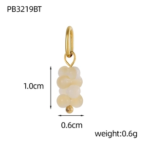 Detailed view of handmade rice pearl daisy charm with dimensions 1.0cm by 0.6cm