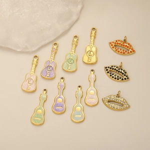 Golden guitar and lip pendant set with colorful enamel and sparkling rhinestones