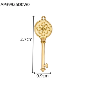 Macro shot of gold key pendant with floral knot design and 2.7cm height measurement