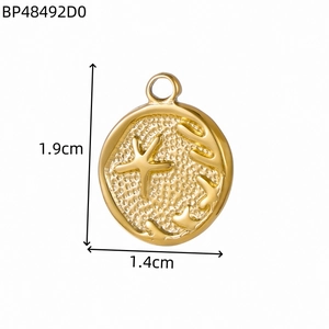 Golden stainless steel ocean pendant with starfish and coral relief on hammered texture