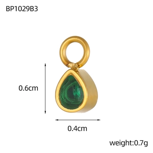 Macro shot of 0.6cm green pear-cut crystal pendant in gold setting for jewelry making