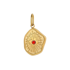 Detail of vintage gold evil eye pendant with red zircon and radiating line patterns