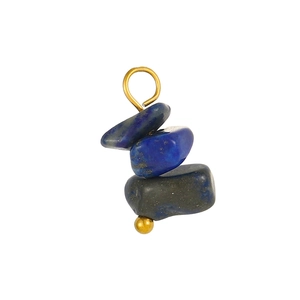 Detailed view of bohemian lapis lazuli stone pendant with irregular raw blue crystals