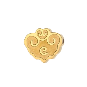 Macro detail of golden Ruyi lock charm with traditional Chinese cloud patterns for DIY jewelry