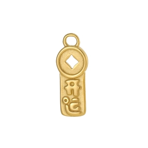Macro detail of a gold rectangular pendant featuring embossed Chinese Kaixin characters