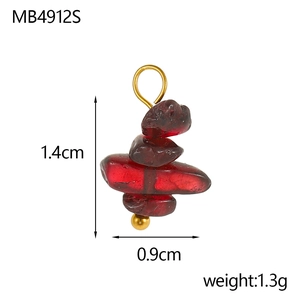Detail view of a 1.4cm bohemian irregular red crystal pendant with gold hardware