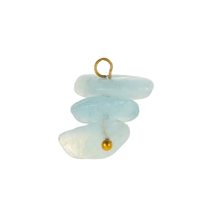 Close-up of bohemian style triple-layered light blue raw stone pendants with gold hooks