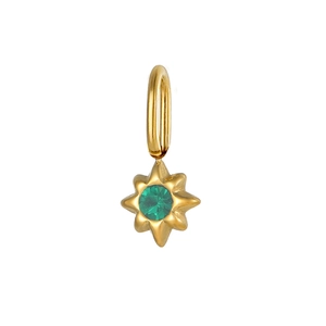 Detailed close-up of a golden eight-pointed star pendant with a green center stone