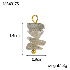 Detail of bohemian gray natural stone pendant with gold bead and spiral layered design