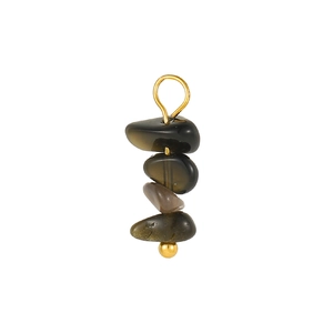 Detail of stacked dark green translucent raw stones with golden metal axis and ring