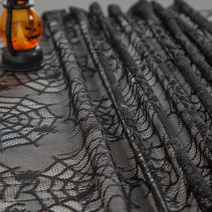 Black lace spider web tablecloth with pumpkin lamp for Halloween dining table decoration