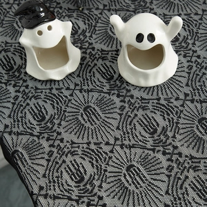 Ghost ceramic halloween figurines on black lace spider web tablecloth table decor