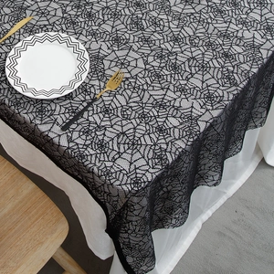 Black lace spider web tablecloth for Halloween party decor over a white base