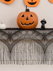 Detail of Halloween black lace fireplace mantel scarf with bat patterns and fringe
