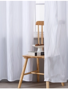 Detail of white semi-sheer curtain with elegant vertical wave jacquard texture and soft light