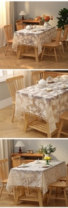 Detailed view of cream lace tablecloth featuring floral embroidery and elegant fringe edges
